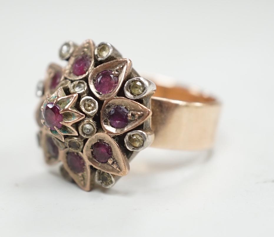An antique yellow metal and two colour paste set cluster dress ring, size O, gross weight 10.8 grams.